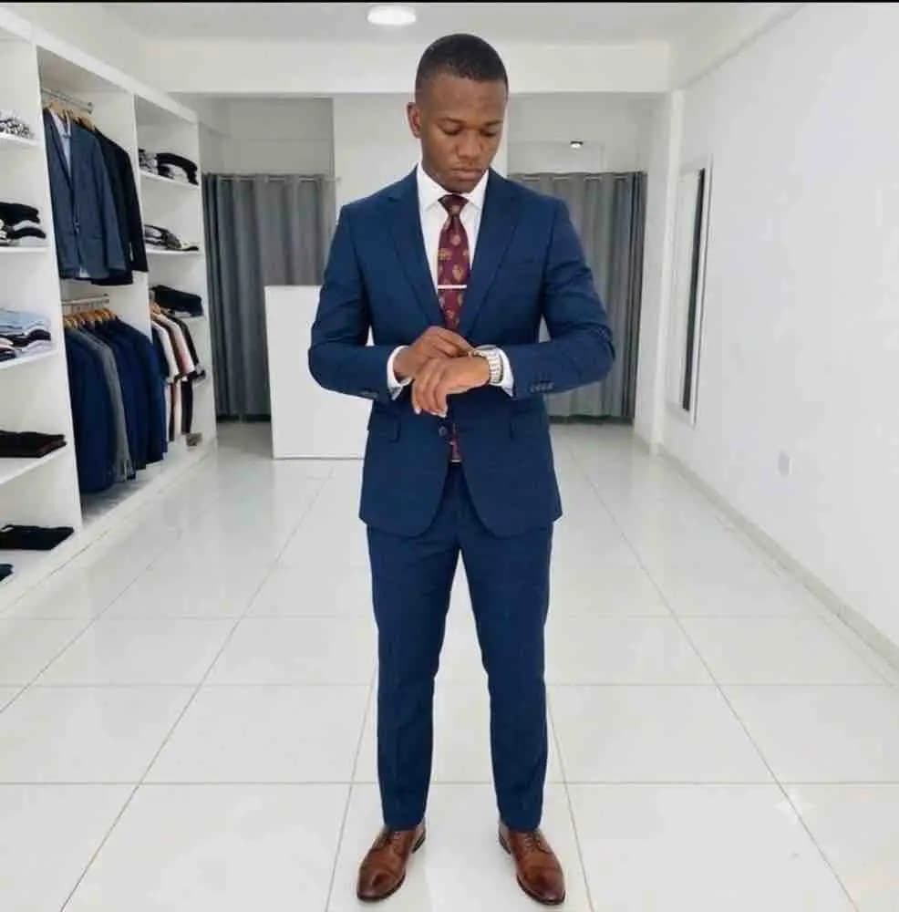 Man in a navy suit at ELIJAYS